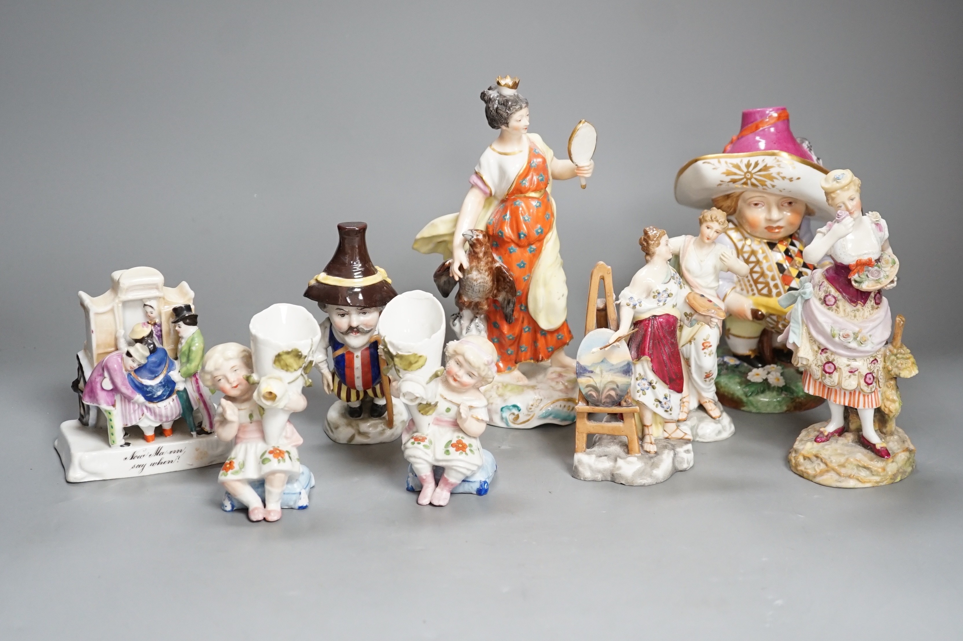 A selection of mainly Continental porcelain figures including Royal Crown Derby style mansion house dwarf